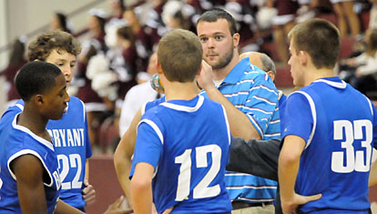 Bryant coach Tyler Posey instructs his team during a timeout. (Photo by Kevin Nagle)