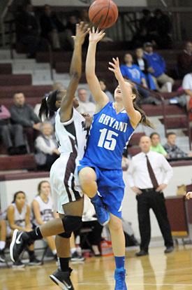 Daniele Singleton (15) tries to get a shot over a Benton defender. (Photo by Kevin Nagle)