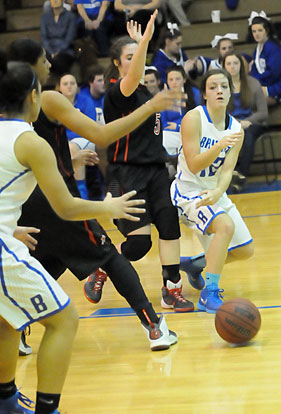 Bryant's Maddie Baxter (12) bounces a pass inside to a teammate during Tuesday's game. (Photo by Kevin Nagle)