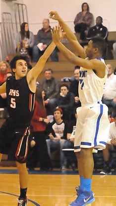 Romen Martin fires up a shot over Russellville's Jacob Boles. (Photo by Kevin Nagle)