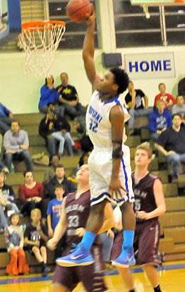 Lowell Washington finished with 11 points, 13 rebounds and this dunk. (Photo by Kevin Nagle)
