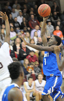 Calvin Allen lofts a shot over a Benton defender. (Photo by Kevin Nagle)