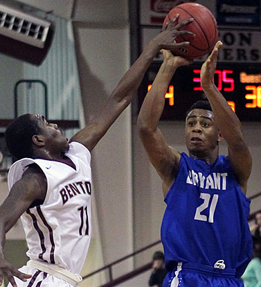 Benton's Quawn Marshall (11) gets a hand on Romen Martin's shot. (photo by Rick Nation)