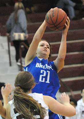 Cayla McDowell (21) hauls down a rebound. (Photo by Kevin Nagle)
