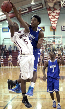 Lowell Washington (32) appears to have Tyrin Hollis' shot blocked but was called for a foul on the play. (Photo by Rick Nation)