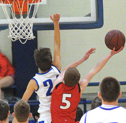 Bryant's Brandon Hill (24) tries to block a shot by Cabot South's Jared Vance (5). (Photo by Kevin Nagle)