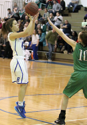 Maddie Baxter (12) takes aim at a jumper as Kaylee Sheppard defends for Van Buren. (Photo by Rick Nation)