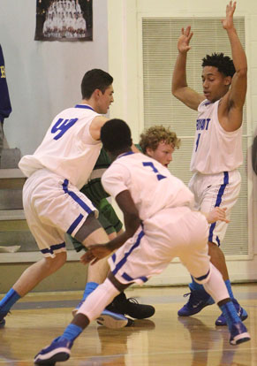 Kyle Sahr (44) and Wesley Peters (4) try to trap Van Buren's Restin Hawkins. (Photo by Rick Nation)