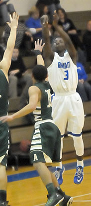 Calvin Allen (3) launches a buzzer-beating 3 over Alma's Will Cluck (1) at the end of the first quarter. (Photo by Kevin Nagle)