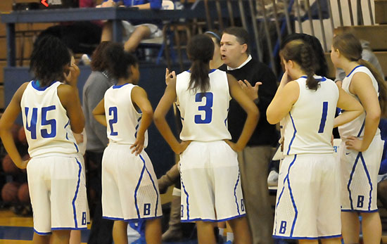 Lady Hornets coach Brad Matthews talks to his JV team during a timeout in Friday's game. (Photo by Kevin Nagle)