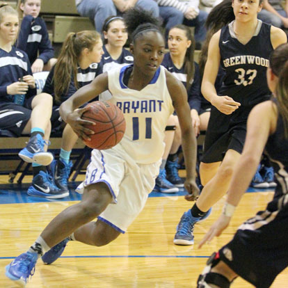 Lauren Carroll (11) drives the baseline. (Photo by Rick Nation)