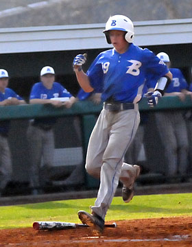 Logan Allen crosses the plate with what proved to be the winning run. (Photo by Kevin Nagle)