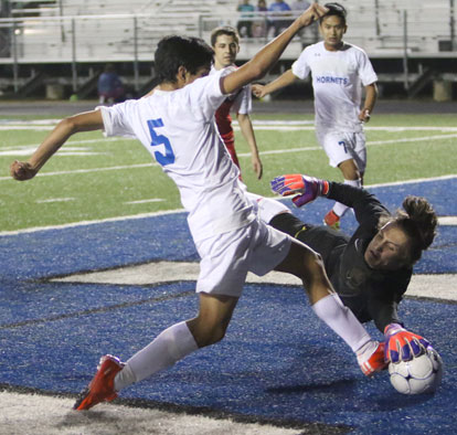 Ricky Barrientos attacks the Cabot keeper. (Photo by Rick Nation)