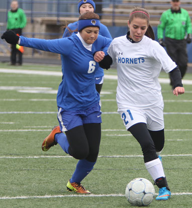 Allison Hughes, right, battles past a Valley View defender. (Photo by Rick Nation)