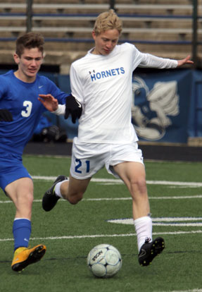 Dalton Bryant hustled to keep control of the ball against a Valley View defender. (Photo by Rick Nation)