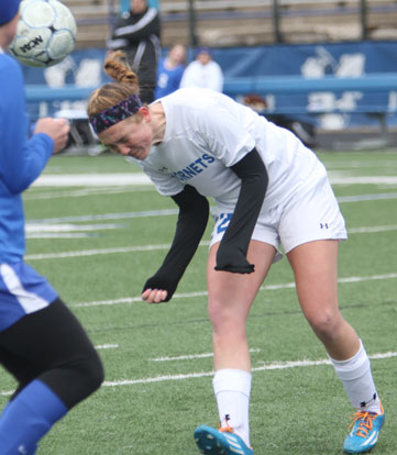 Britney Sahlmann heads the ball to a teammate. (Photo by Rick Nation)