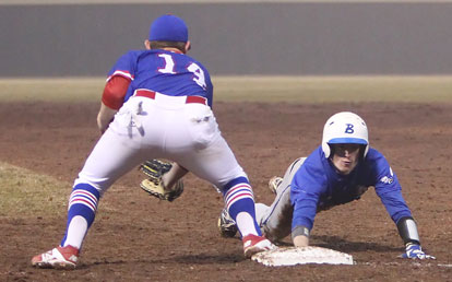 Seth Tucker slides back into first on a pick-off attempt. (Photo by Rick Nation)