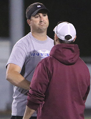 Bryant coach Jason Hay shakes hands with Benton coach Bobby Winn. (Photo by Rick Nation)