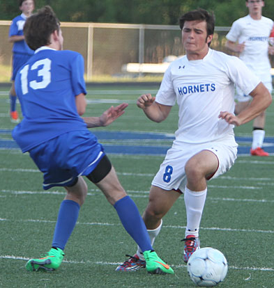 Houston Clifton (8) vies with a Conway player for control of the ball. (Photo by Rick Nation)