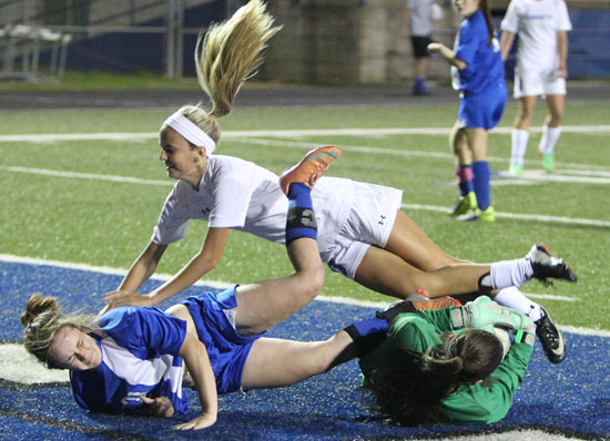 Anna Lowery gets tangled up with a pair of Conway players on her second-half goal. (Photo by Rick Nation)