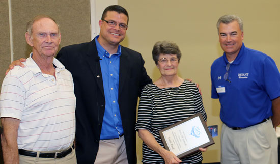 The grandparents of Travis Wood accepted his plaque for induction into the Bryant Athletic Hall of Honor. (Photo by Rick Nation)