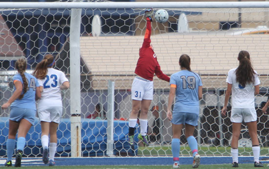 Bryant's junior keeper Kayla Dreher (31) leaps and reaches for a Fort Smith Southside shot Friday. (Photo by Rick Nation)