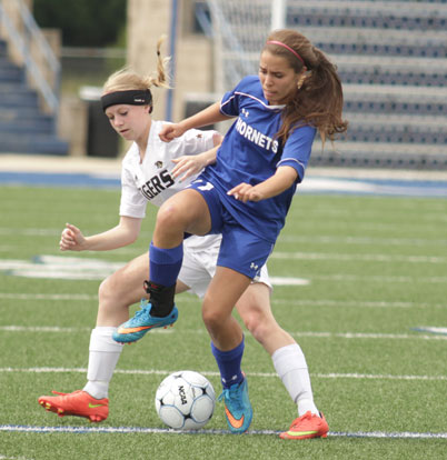 Allison Hughes contends for possession during Saturday's Class 7A State Tournament semifinal. (Photo by Kenzi Brenton)