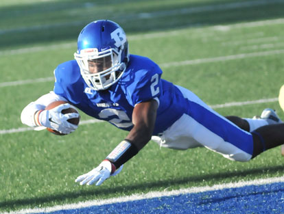 Sevante Turner stretches across the goal line to complete his touchdown run. (Photo by Kevin Nagle)