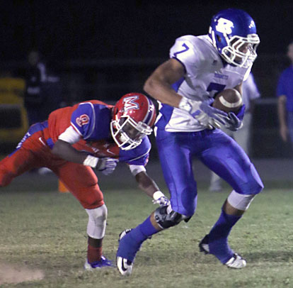 Jaelyn Jones secures one of his two interceptions. (Photo by Rick Nation)