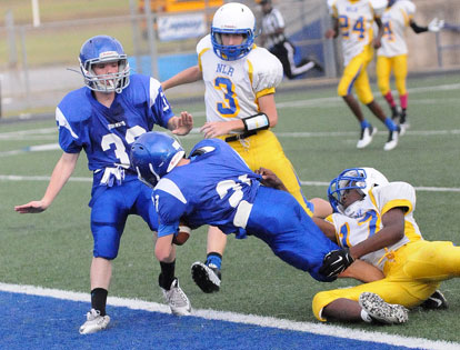 Bethel's Hayden Holt (21) falls forward into the end zone on a touchdown pass with teammate Dalen McDonald (32) on hand. (photo by Kevin Nagle)