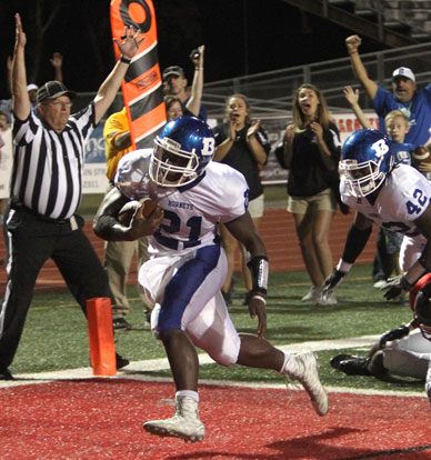 Cameron Coleman, with the help of a block from Demaja Price (42) steps into the end zone for Bryant's first go-ahead touchdown. (Photo by Rick Nation)