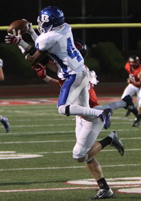 Bryant's Quentin Royal (4) goes high to battle for a pass. (Photo by Rick Nation)