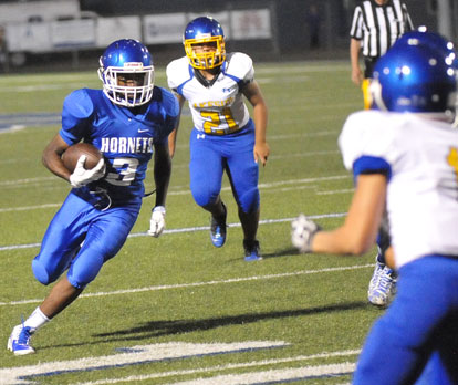 Keethan Hudson (3) turns the corner. (Photo by Kevin Nagle)