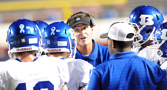 Coach Paul Calley instructs a group of his players. (Photo by Kevin Nagle)