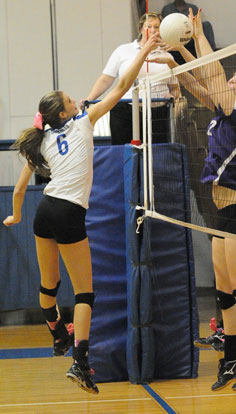 Allie Anderson (6) contends with a pair of Mount St. Mary blockers. (Photo by Kevin Nagle)