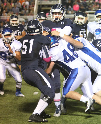 Bryant's Peyton Robertson (48) and Walker Brown (51) make a stop. (Photo by Rick Nation)