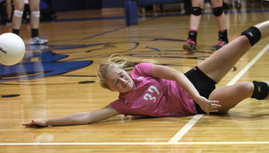 Whitney Brown dives for a dig during Tuesday's match. (Photo by Rick Nation)