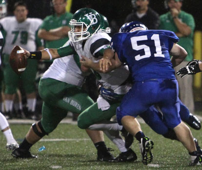 Walker Brown (51) gets in on a sack of Van Buren quarterback Jordan Barlow. (Photo by Rick Nation)