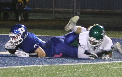 Bryant receiver Aaron Orender was tackled just a little too late as he scored as part of a 47-yard touchdown pass just before halftime on Friday night. (Photo by Rick Nation)