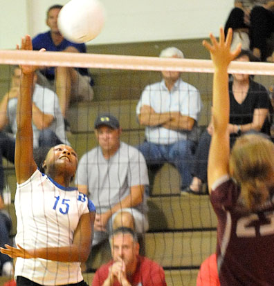 Jad'n Nichols (15) attacks the net. (Photo by Kevin Nagle)