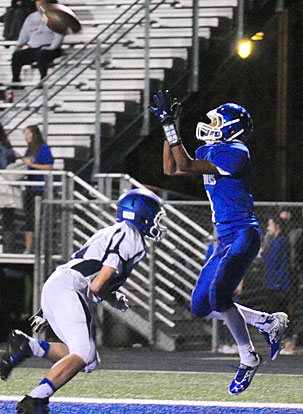 Andrew Hayes, right, hauls in a touchdown pass over a Conway White defender. (Photo by Kevin Nagle)