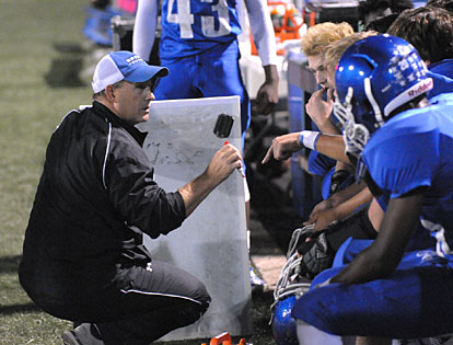 Bryant coach John Orr talks to his defense on the sideline during Thursday night's game. (Photo by Kevin Nagle)