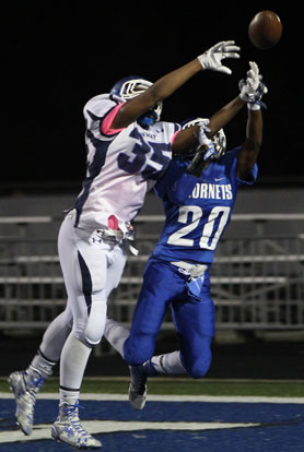 Bryant's K.J. Terry (20) contends with Conway White's Terry Clardy for a pass into the end zone. (Photo by Rick Nation)