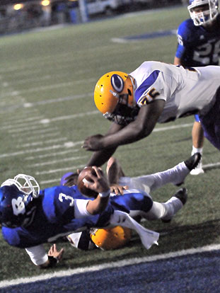 Bryant quarterback Gunnar Burks reaches for the end zone on a play in which he lost the ball and Catholic recovered. (Photo by Kevin Nagle)