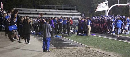 The Bryant team gathers in the South end zone, joining the band in the bleachers to celebrate Friday's 30-10 win over Little Rock Catholic. (Photo by Rick Nation)