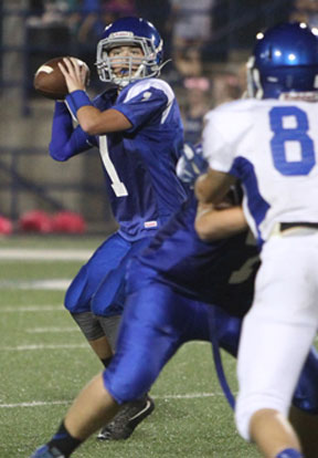 Bryant Blue quarterback Jake Meaders looks for an open receiver. (Photo by Rick Nation)