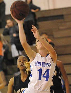 Meagan Chism goes up for a shot after a drive up the baseline. (Photo by Kevin Nagle)