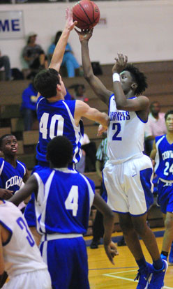 Rodney Lambert (2) shoots over a Conway White defender off a drive into the lane. (Photo by Kevin Nagle)