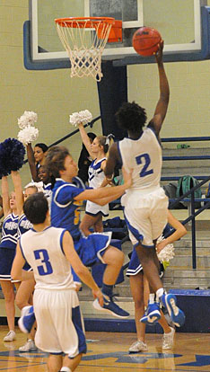 Rodney Lambert (2) is fouled as he scores. (Photo by Kevin Nagle)