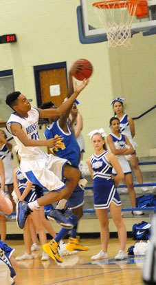 Josh Robinson (21) drives to the hoop. (Photos by Kevin Nagle)